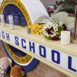 Memorial items are shown on the sign of Oxford High School on Wednesday, Dec. 1, 2021. (AP file)
